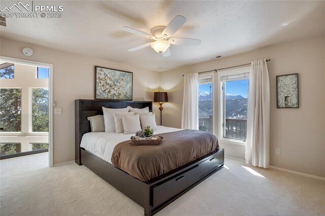 bedroom with carpet floors, visible vents, and baseboards