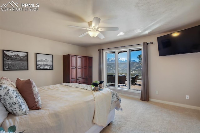 bedroom featuring baseboards, a ceiling fan, and light colored carpet