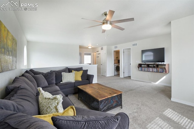 carpeted living room with visible vents, ceiling fan, washer / clothes dryer, and baseboards