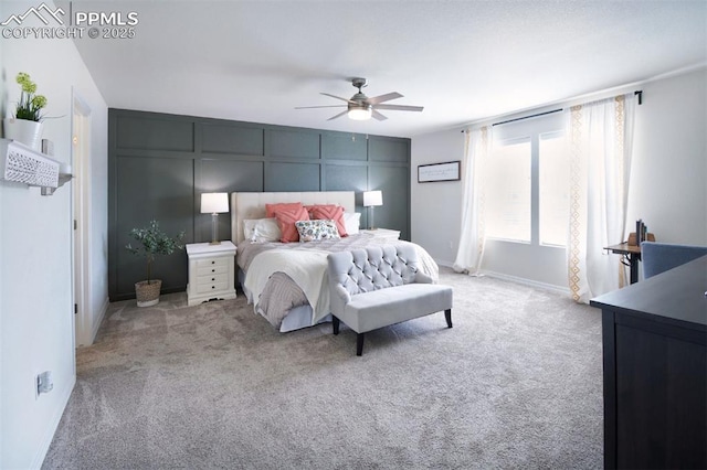 bedroom with baseboards, ceiling fan, and carpet floors