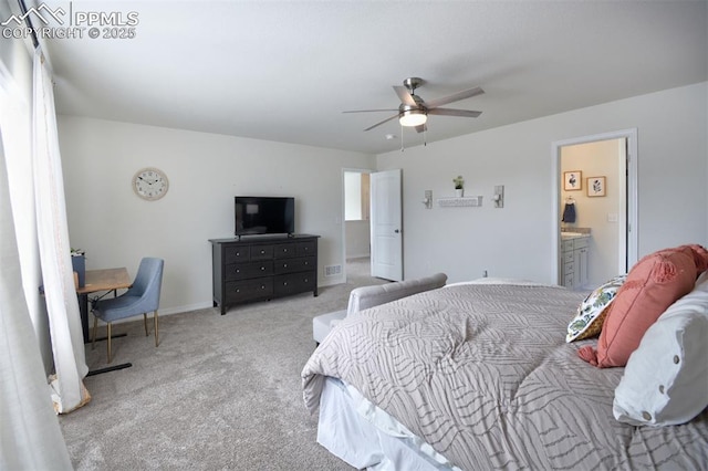 carpeted bedroom featuring connected bathroom, baseboards, visible vents, and ceiling fan