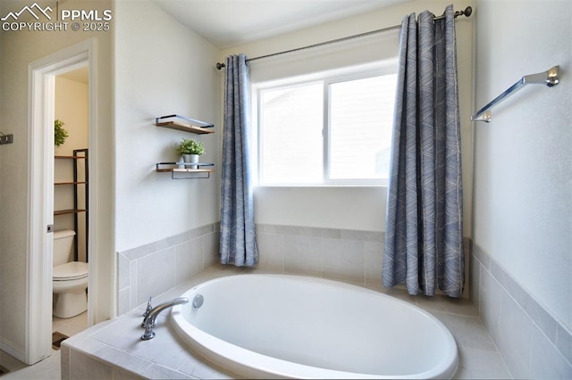 bathroom with toilet and a bath