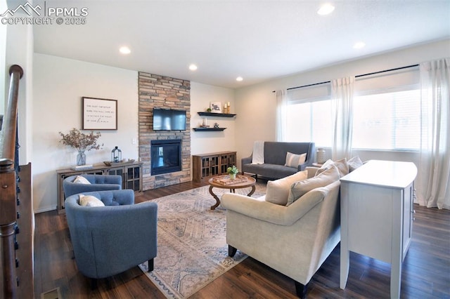 living area featuring dark wood-style floors, recessed lighting, and a fireplace