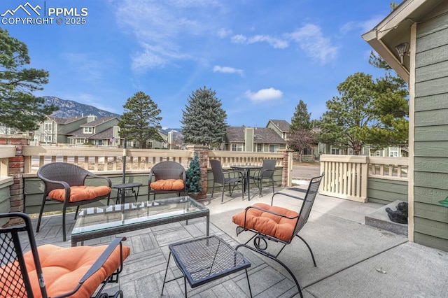 view of patio with outdoor dining space and a residential view