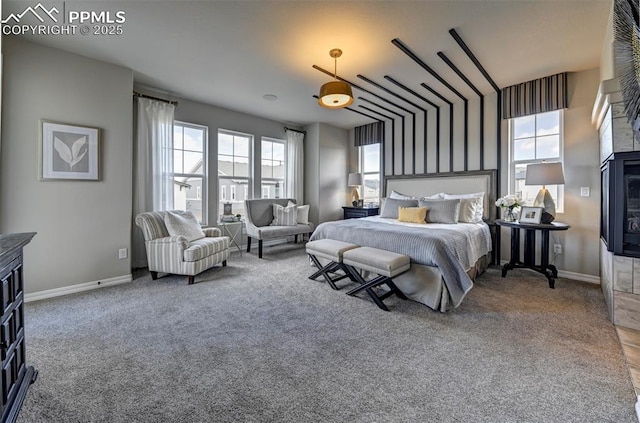 bedroom with carpet and baseboards