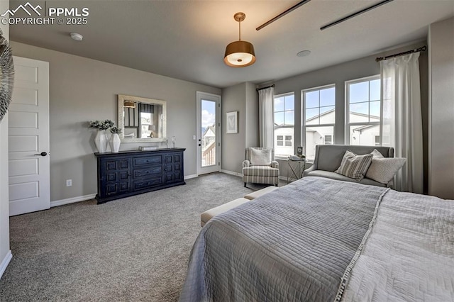 bedroom featuring access to exterior, carpet flooring, and baseboards