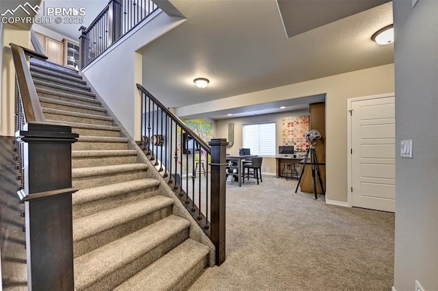 staircase with carpet and baseboards