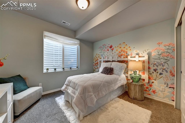 carpeted bedroom with visible vents and baseboards