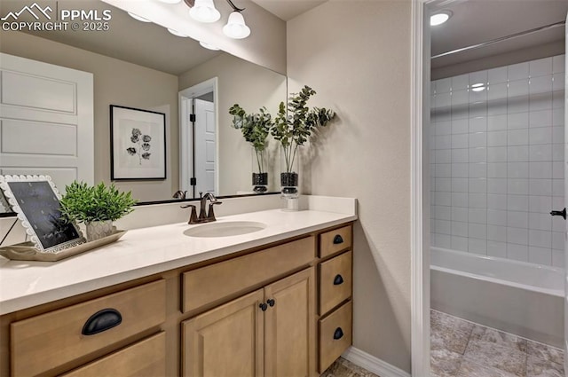 full bathroom featuring  shower combination, vanity, and baseboards