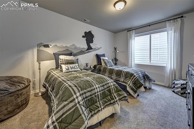 carpeted bedroom with visible vents and baseboards