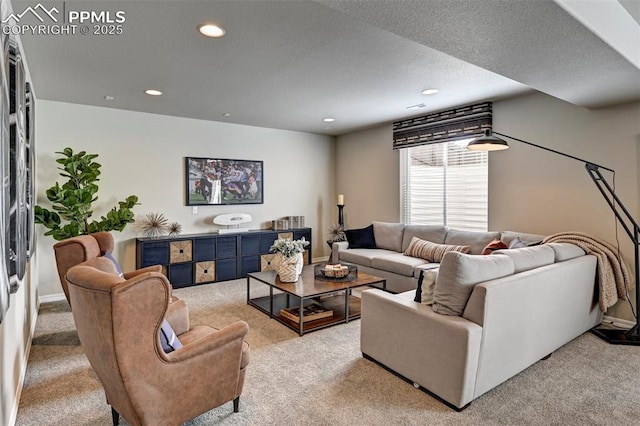 living room with a textured ceiling, light colored carpet, and recessed lighting