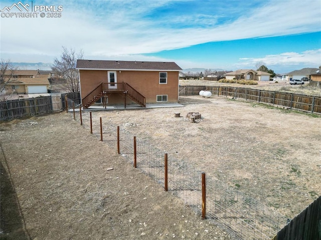 view of yard with an outdoor fire pit and a fenced backyard