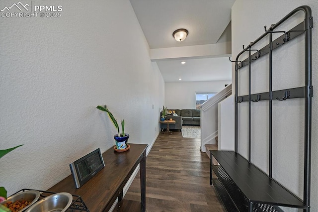 entrance foyer featuring stairs and wood finished floors