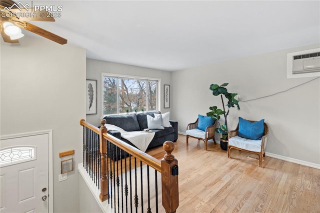 4127 Bent Dr, Colorado Springs, CO 80909 - interior space with light wood-style flooring, baseboards, a wall mounted AC, and ceiling fan