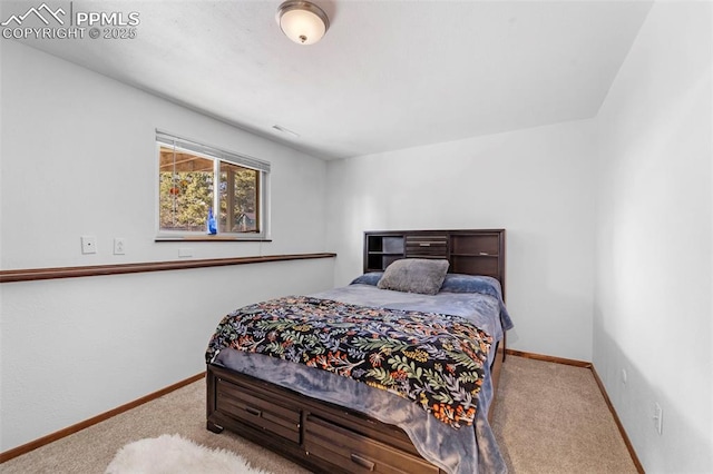 carpeted bedroom with baseboards