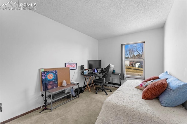 carpeted bedroom featuring baseboards and a textured ceiling