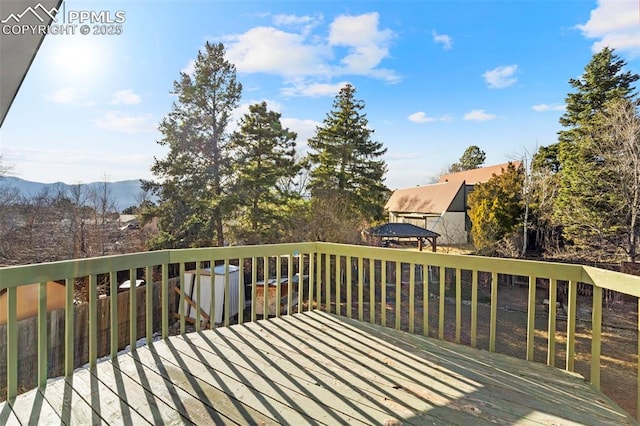 wooden deck with a mountain view