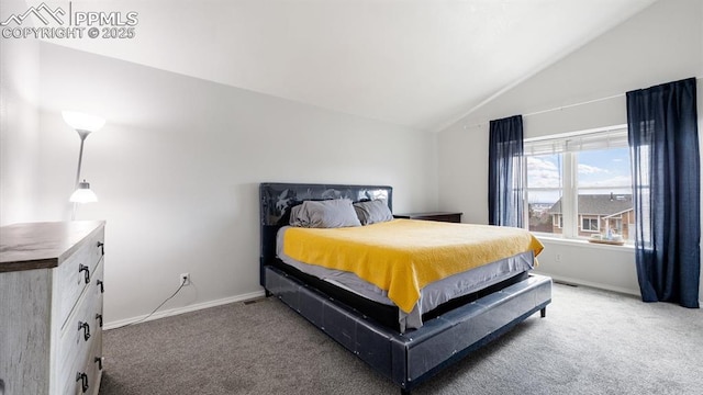 bedroom with baseboards, vaulted ceiling, and light colored carpet