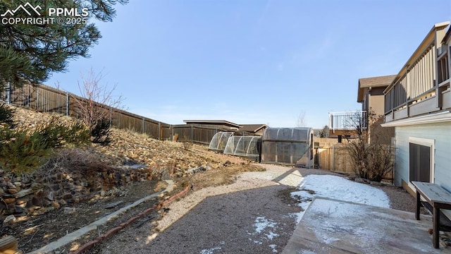 view of yard featuring a patio area and a fenced backyard