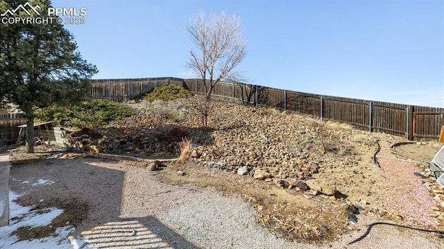 view of yard with a fenced backyard