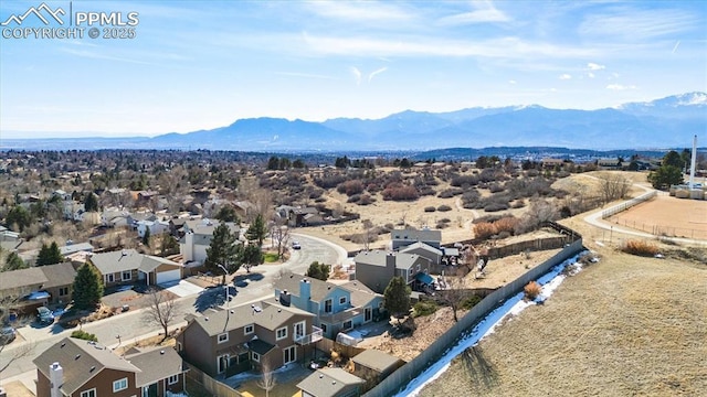 drone / aerial view featuring a mountain view and a residential view