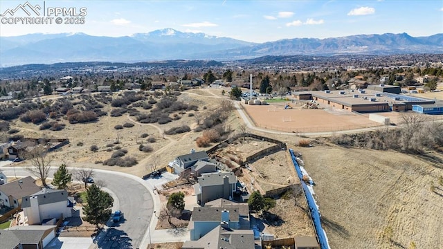 drone / aerial view with a residential view and a mountain view