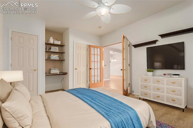 carpeted bedroom with a ceiling fan