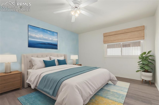 bedroom with wood finished floors, a ceiling fan, and baseboards