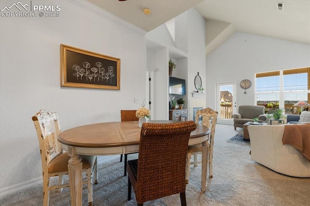 dining room with crown molding, visible vents, carpet flooring, high vaulted ceiling, and baseboards