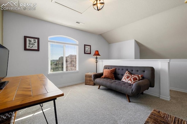 interior space featuring baseboards, vaulted ceiling, and carpet flooring