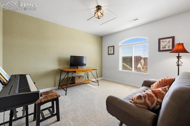 carpeted home office featuring baseboards and visible vents