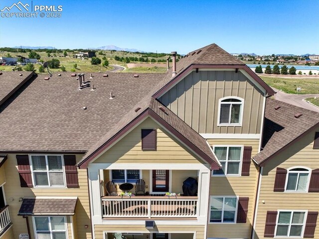 view of front of property featuring board and batten siding and a shingled roof