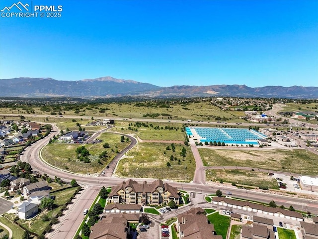 birds eye view of property featuring a mountain view