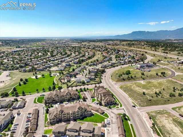 birds eye view of property featuring a mountain view and a residential view