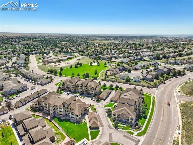 birds eye view of property with a residential view