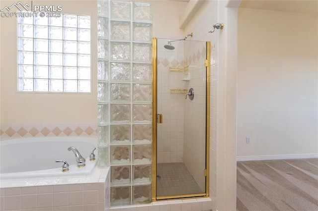 full bathroom featuring a shower stall and a garden tub