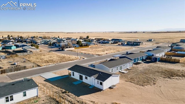 bird's eye view featuring a residential view and view of desert