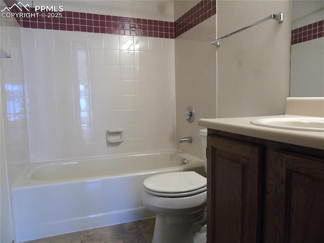 bathroom featuring vanity, toilet, bathing tub / shower combination, and tile patterned flooring