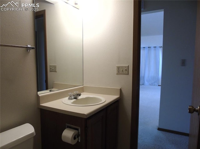 bathroom with vanity and toilet