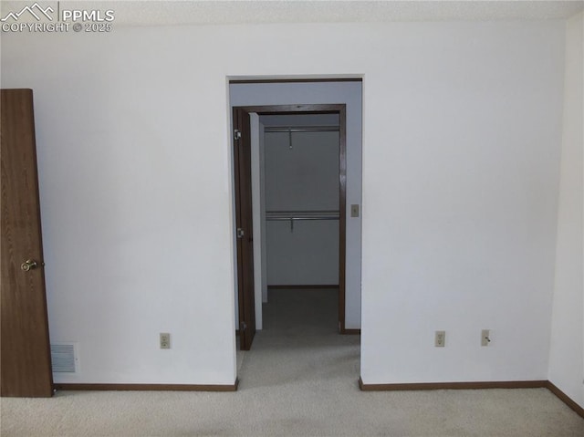 interior space featuring baseboards and visible vents