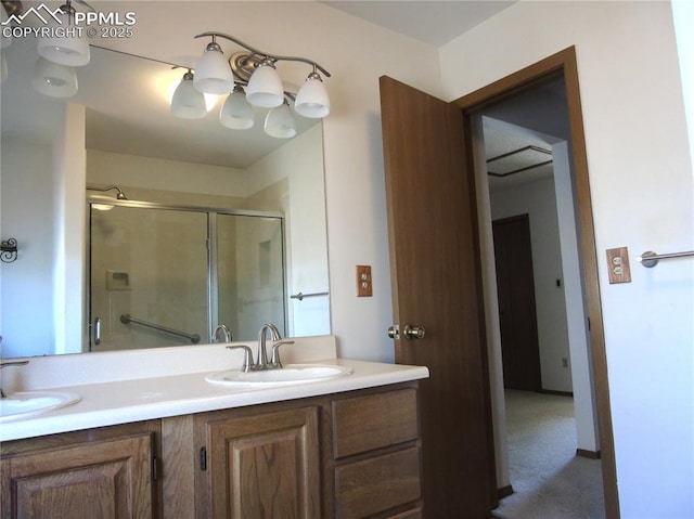 full bath featuring a shower stall, double vanity, and a sink