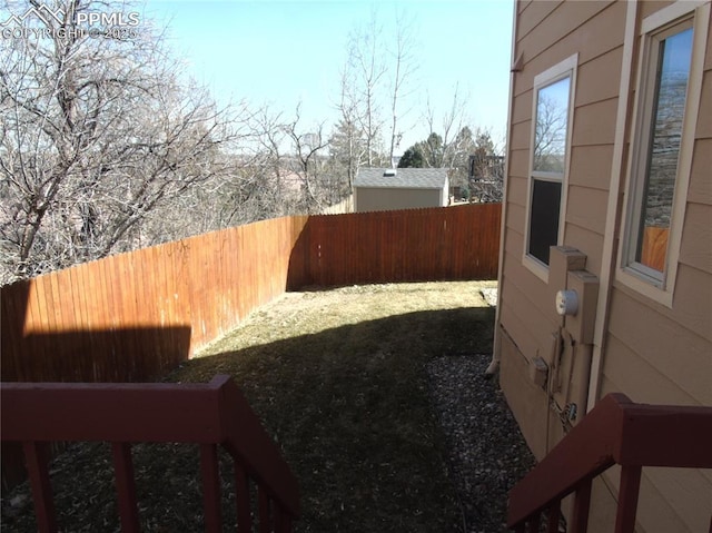 view of yard featuring a fenced backyard