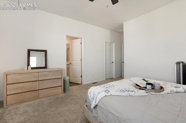 bedroom with ceiling fan, carpet floors, and connected bathroom