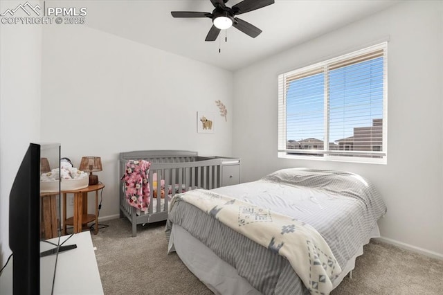 bedroom with ceiling fan, baseboards, and carpet flooring