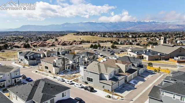 birds eye view of property with a residential view and a mountain view