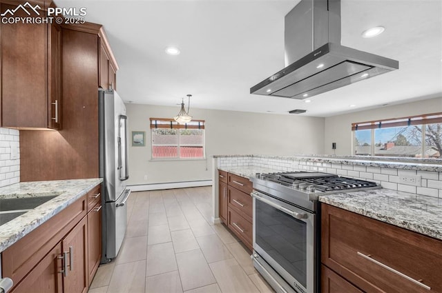 kitchen with light stone counters, stainless steel appliances, backsplash, and island range hood