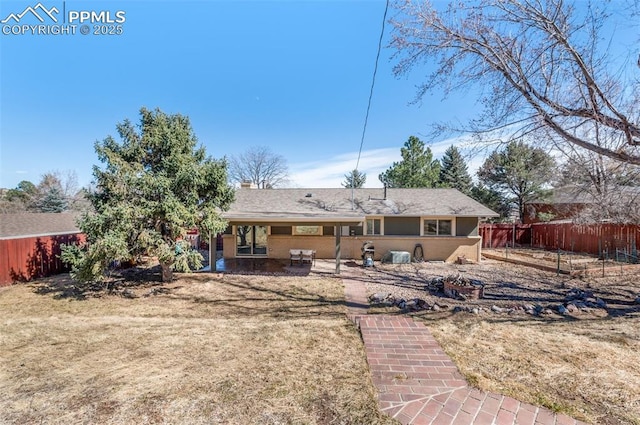 rear view of property with fence