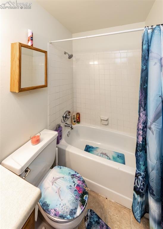 full bath featuring toilet, tile patterned flooring, shower / bath combo with shower curtain, and vanity