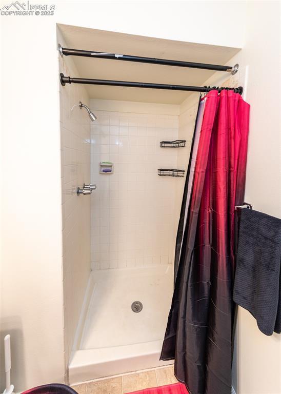 bathroom with a shower stall