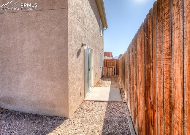 view of home's exterior with a fenced backyard and stucco siding